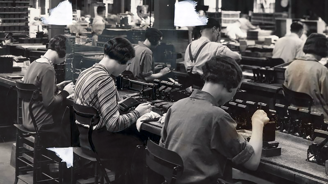 1280x720px-Production-line-workers-assembling-Kodak-cameras,-Harrow,-c-1930s-vWA24